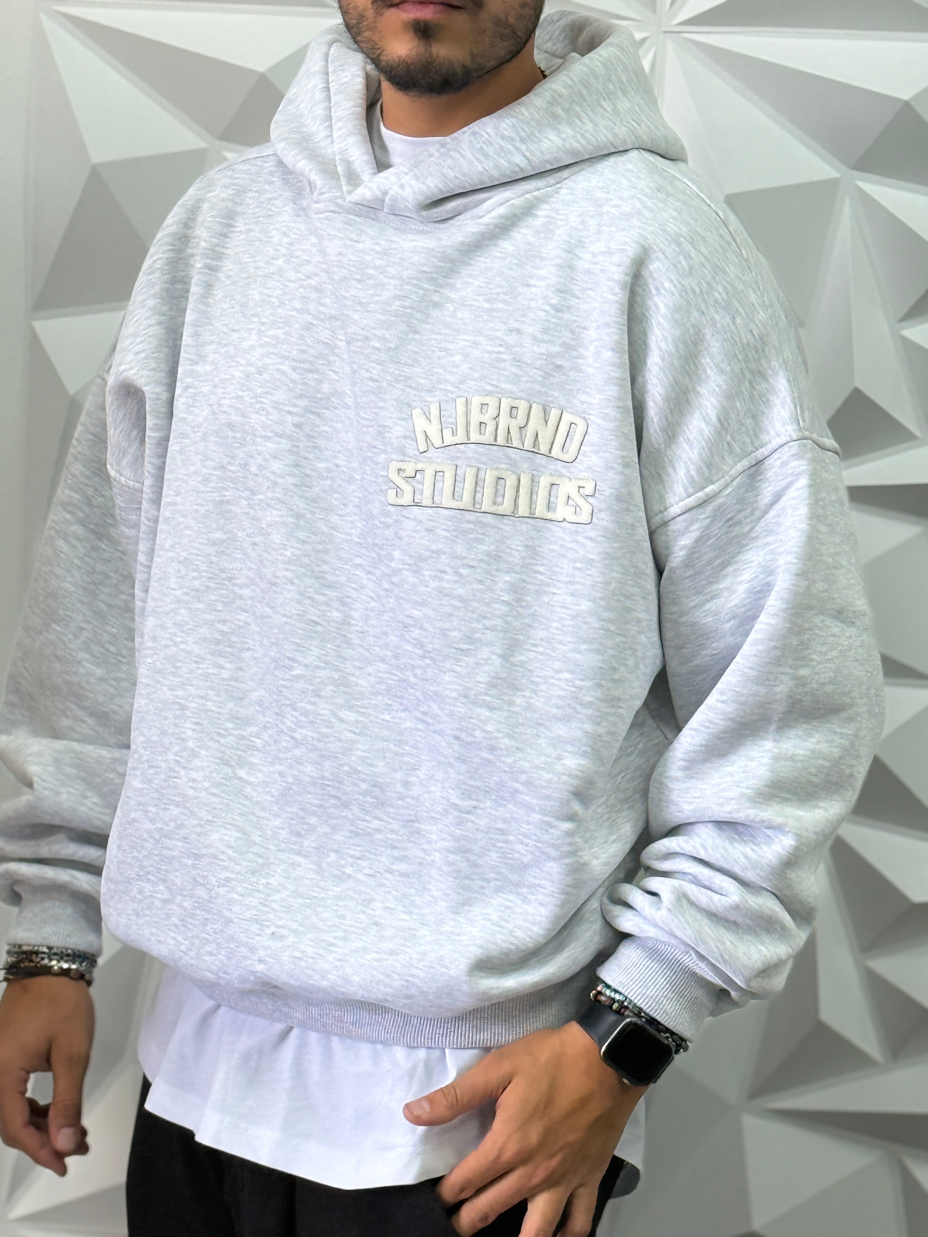 Felpa oversize grigia cappuccio studios New job brand